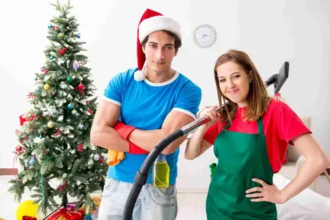 Man and woman cleaning for the holidays