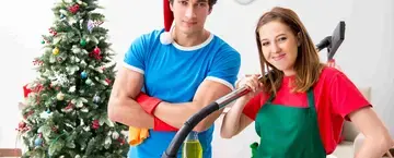 Man and woman cleaning for the holidays