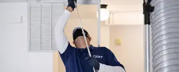 COIT Technician cleaning Air Ducts