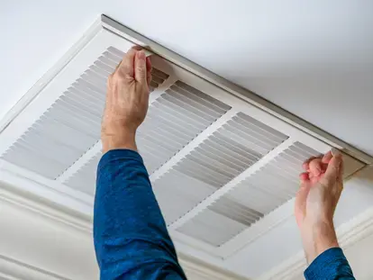 Man with blue shirt releases HVAC locks to begin maintenance