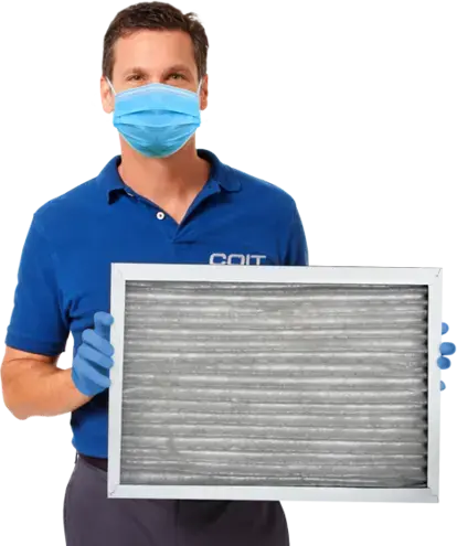 technician holding an air filter