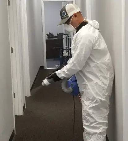 COIT technician fogging in hallway