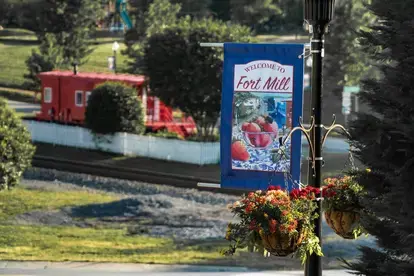 Welcome flags on main street in historic downtown Fort Mill, South Carolina.