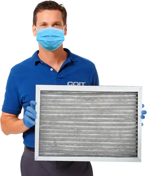 technician holding an air filter